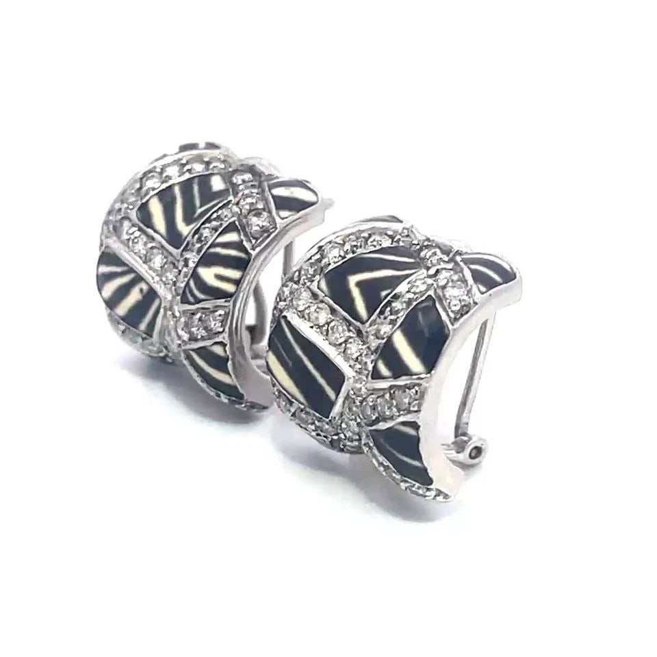 DIAMOND ENAMEL GOLD EARRINGS 18K WHITE ZEBRA STYLE HUGGIE POST CLIP: DIAMOND ENAMEL GOLD EARRINGS 18K WHITE ZEBRA STYLE HUGGIE POST CLIP These chic earrings features stylish rectangle pieces zebra design enamel set between diamond strips on a wide curve shape and a hug