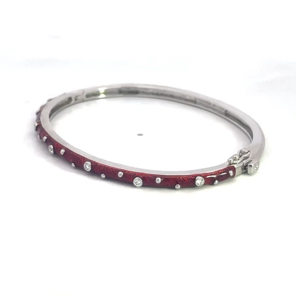 HIDALGO DIAMOND GOLD BANGLE 18K WHITE SLIM RED ENAMEL OVAL SHAPE: This is an authentic bangle by Hidalgo, it is crafted from 18k white gold featuring a slim dome bangle oval shaped with hinged mechanism on one side and slide clasp. The front half has red enamel with