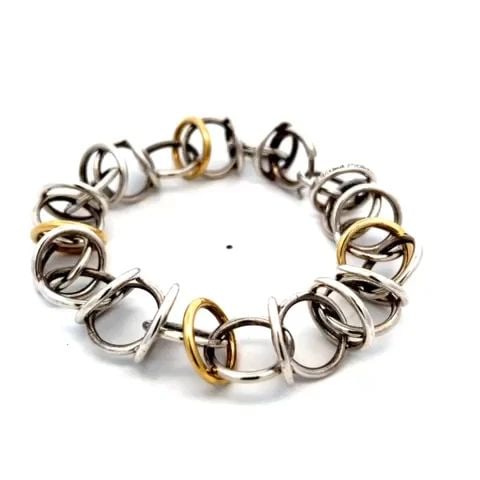 TIFFANY & CO. PICASSO BRACELET WOVEN RINGS STERLING SILVER 18K YELLOW GOLD: TIFFANY & CO. PICASSO BRACELET WOVEN RINGS STERLING SILVER 18K YELLOW GOLD This is a vintage authentic bracelet from Tiffany & Co. by Paloma Picasso, it is crafted from sterling silver with four 18k y