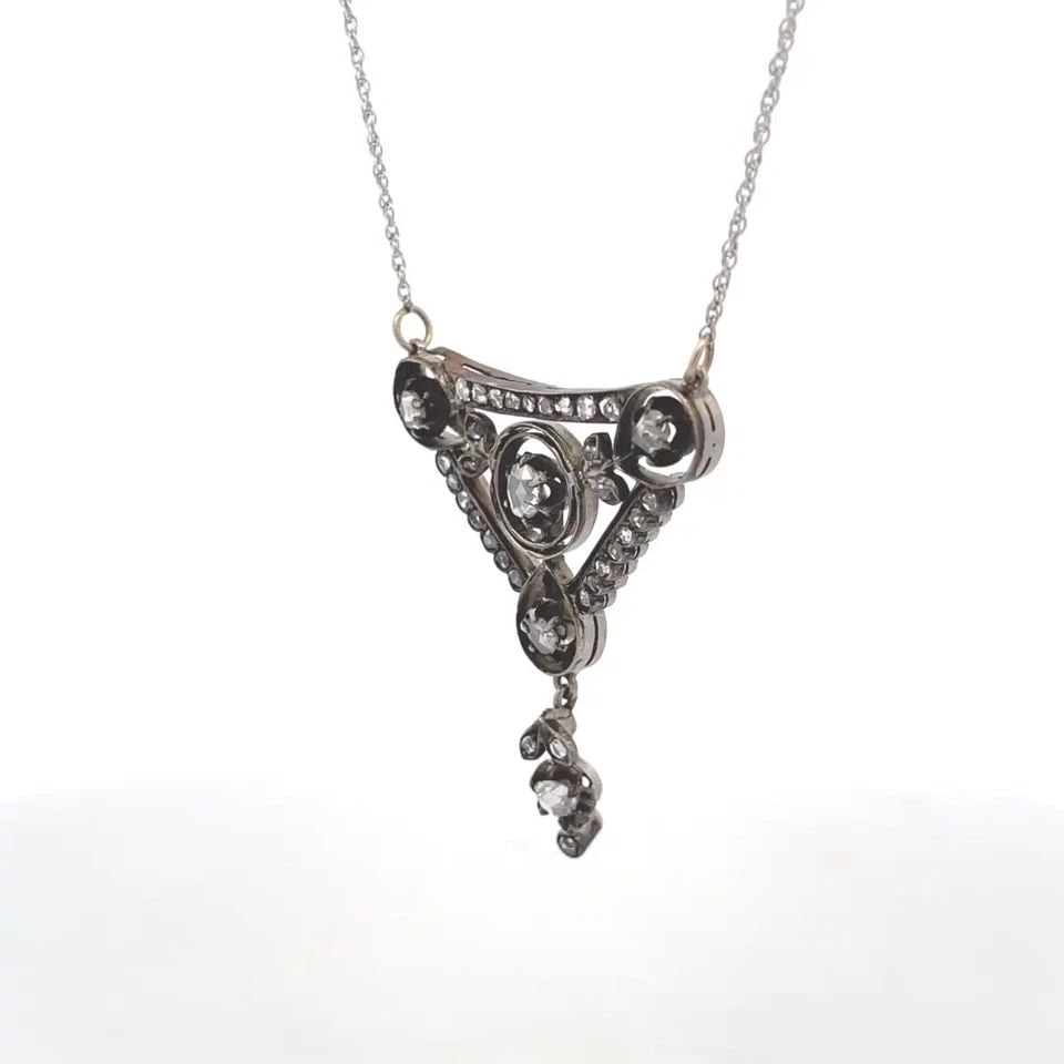 VINTAGE ROSE CUT DIAMOND SILVER AND GOLD TWO TONE GOLD DANGLE PENDANT & CHAIN: VINTAGE ROSE CUT DIAMOND SILVER AND GOLD TWO TONE GOLD DANGLE PENDANT & CHAIN This is a beautiful vintage triangle shape dangle pendant and chain. It is crafted in Silver and gold white gold featuring