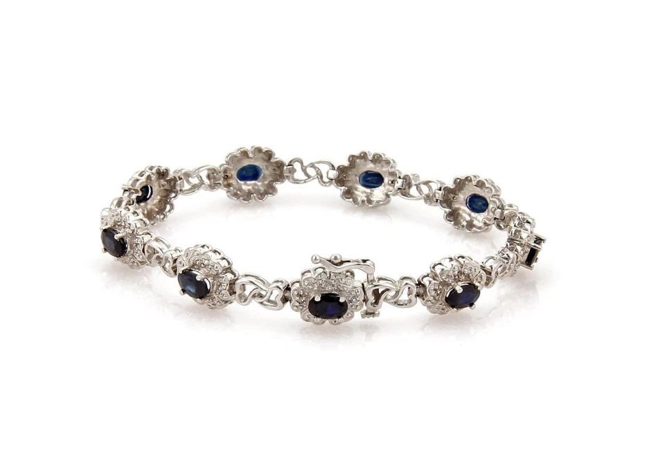 ESTATE 5.18CT SAPPHIRE DIAMOND 14K GOLD FLORAL LINK BRACELET: ESTATE 5.18CT SAPPHIRE DIAMOND 14K GOLD FLORAL LINK BRACELET Estate 5.18ct Sapphire Diamond 14k Gold Floral Link Bracelet !! Description This bracelet is crafted from 14k white gold with a polished fi