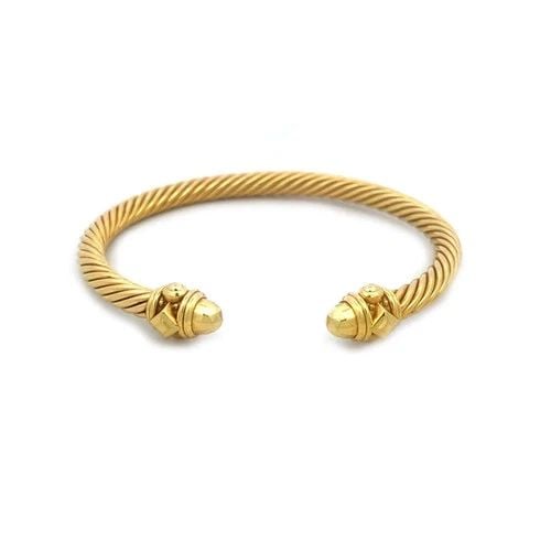 DAVID YURMAN GOLD CABLE CUFF BRACELET 18K YELLOW FACETED CUT KNOBS: DAVID YURMAN GOLD CABLE CUFF BRACELET 18K YELLOW FACETED CUT KNOBS This lovely gold bracelet is by David Yurman from the Classic Cable Collection. It is a stunning piece of fine jewelry crafted from 1