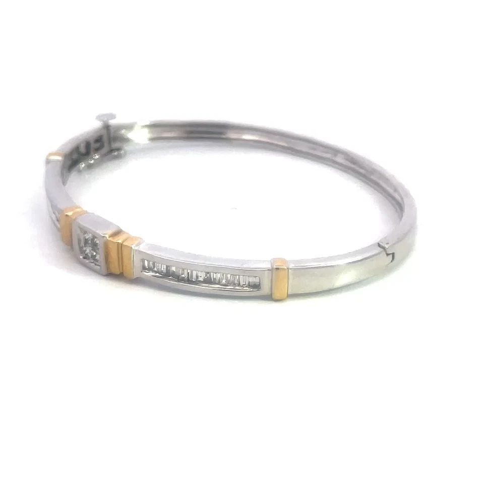 7120 DIAMOND GOLD BANGLE 14K TWO TONE HINGED OVAL SHAPE STYLE: 7120 DIAMOND GOLD BANGLE 14K TWO TONE HINGED OVAL SHAPE STYLE This lovely bangle is a stunning piece of fine jewelry featuring an oval-shaped hinged style, the front half has princess cut diamonds in 
