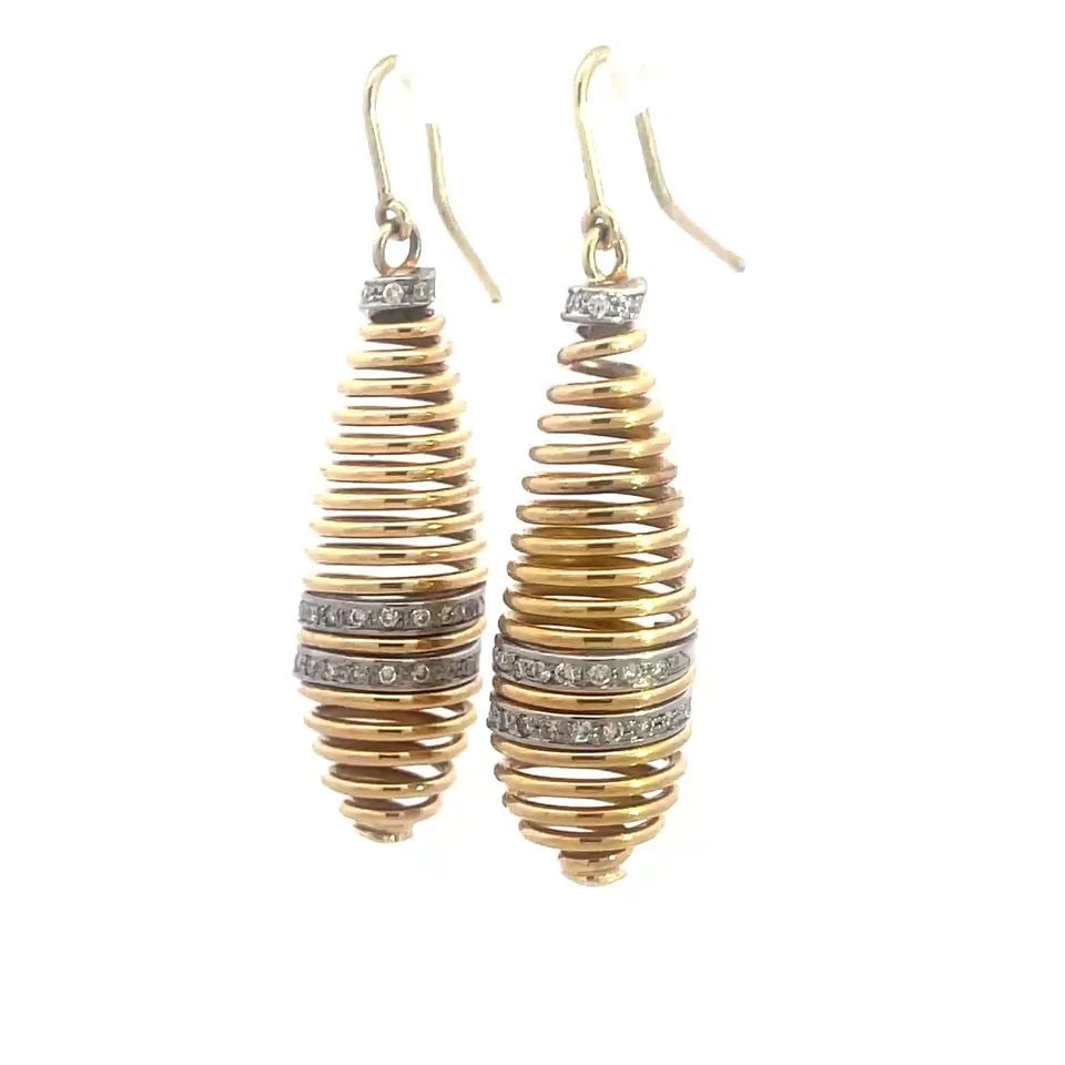 DIAMOND GOLD SPINDLE EARRINGS 14K YELLOW LONG DANGLE STYLE: These beautiful Spindle earrings feature a pair of unique cone shape set in dangle style with a long hook/ear wire closure. Made of 14k yellow and white gold, a row at the top and center part of the e