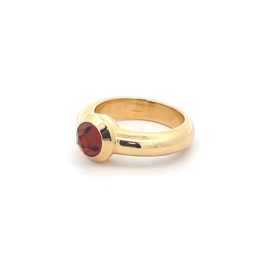 TIFFANY & CO. FRANCE 18K YELLOW GOLD BULLET SHAPE GARNET SOLITAIRE RING: TIFFANY & CO. FRANCE 18K YELLOW GOLD BULLET SHAPE GARNET SOLITAIRE RING This Tiffany & Co. elegant ring is crafted from 18k yellow gold, elegant in a polished finish with a bullet cut garnet set at th