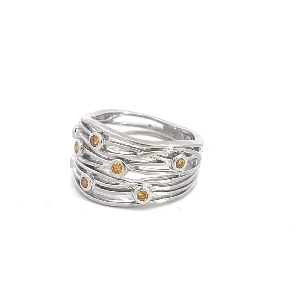 FANCY YELLOW DIAMOND GOLD RING 18K WHITE WIRE WAVE WIDE BAND: FANCY YELLOW DIAMOND GOLD RING 18K WHITE WIRE WAVE WIDE BAND This beautiful open style wire band is crafted from 18k white gold featuring fine multi wires in a wave design, the front half of the band 