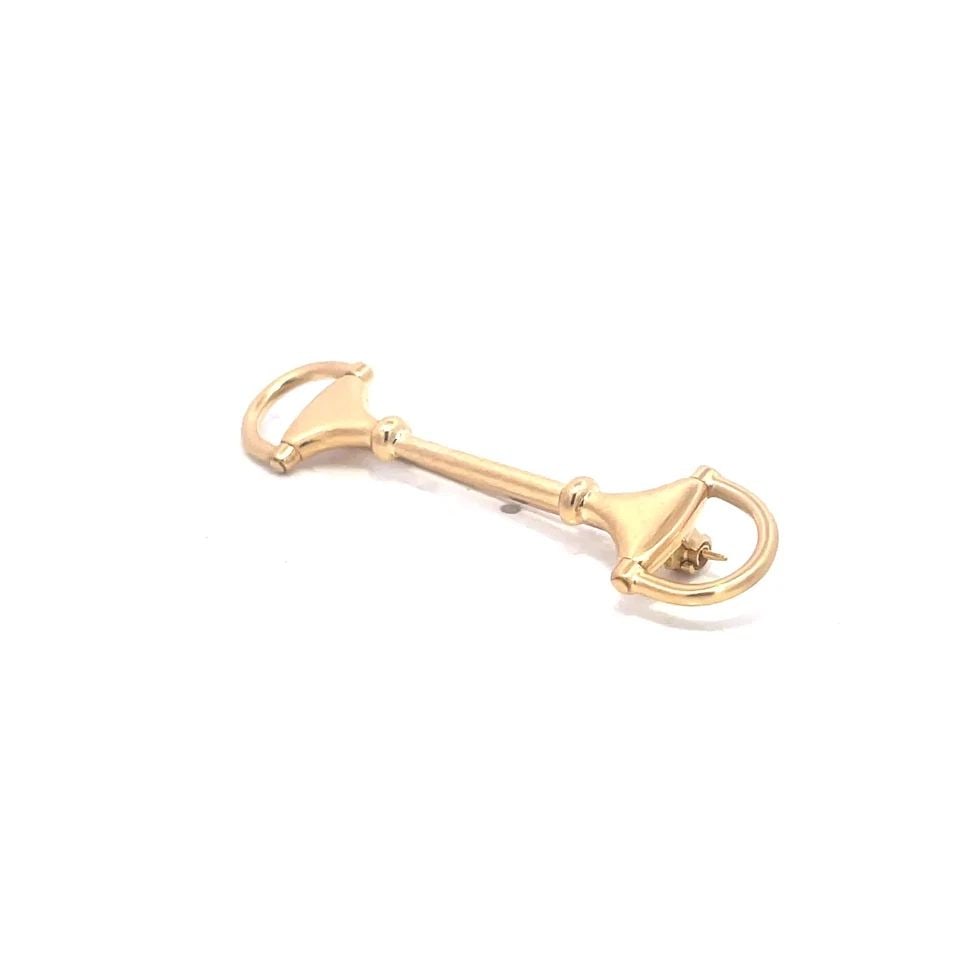 GUCCI GOLD PIN HORSE BIT STYLE 18K YELLOW ITALY: GUCCI GOLD PIN HORSE BIT STYLE 18K YELLOW ITALY The Gucci Gold Pin in Horse Bit Style is a luxurious and stylish accessory crafted in Italy from 18k yellow gold. With a length of 50mm, this pin featur