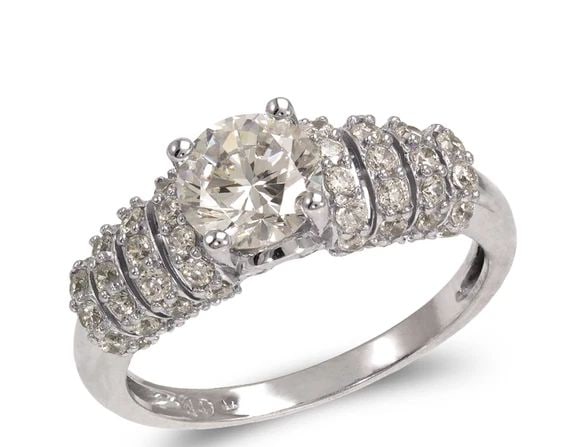 NEW 14K WHITE GOLD LADIES FANCY WHITE SOLITAIRE RING: NEW 14K WHITE GOLD LADIES FANCY WHITE SOLITAIRE RING LADIES FANCY WHITE SOLITAIRE RING NEW 14K WHITE GOLD Apx. WIDTH: 6mm Apx. WEIGHT: 3.6g