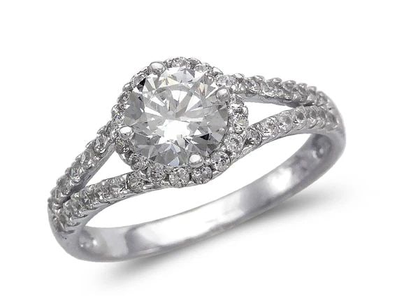 NEW 14K WHITE GOLD LADIES FANCY WHITE HALO SOLITAIRE RING: NEW 14K WHITE GOLD LADIES FANCY WHITE HALO SOLITAIRE RING LADIES FANCY WHITE HALO SOLITAIRE RING NEW 14K WHITE GOLD Apx. WIDTH: 8mm Apx. WEIGHT: 2.9g