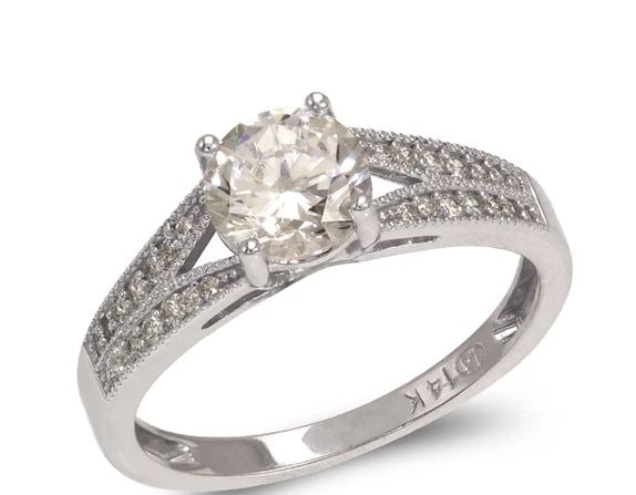 NEW 14K WHITE GOLD LADIES FANCY WHITE SOLITAIRE RING: NEW 14K WHITE GOLD LADIES FANCY WHITE SOLITAIRE RING LADIES FANCY WHITE SOLITAIRE RING NEW 14K WHITE GOLD Apx. WIDTH: 6mm Apx. WEIGHT: 2.8g