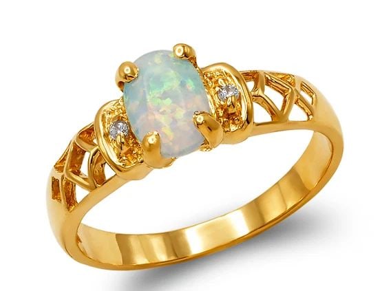NEW 14K TWO TONE GOLD LADIES OPAL RING: NEW 14K TWO TONE GOLD LADIES OPAL RINGLADIES OPAL RINGNEW 14KTWO TONE GOLDApx. WIDTH: 5mmApx. WEIGHT: 2.5g