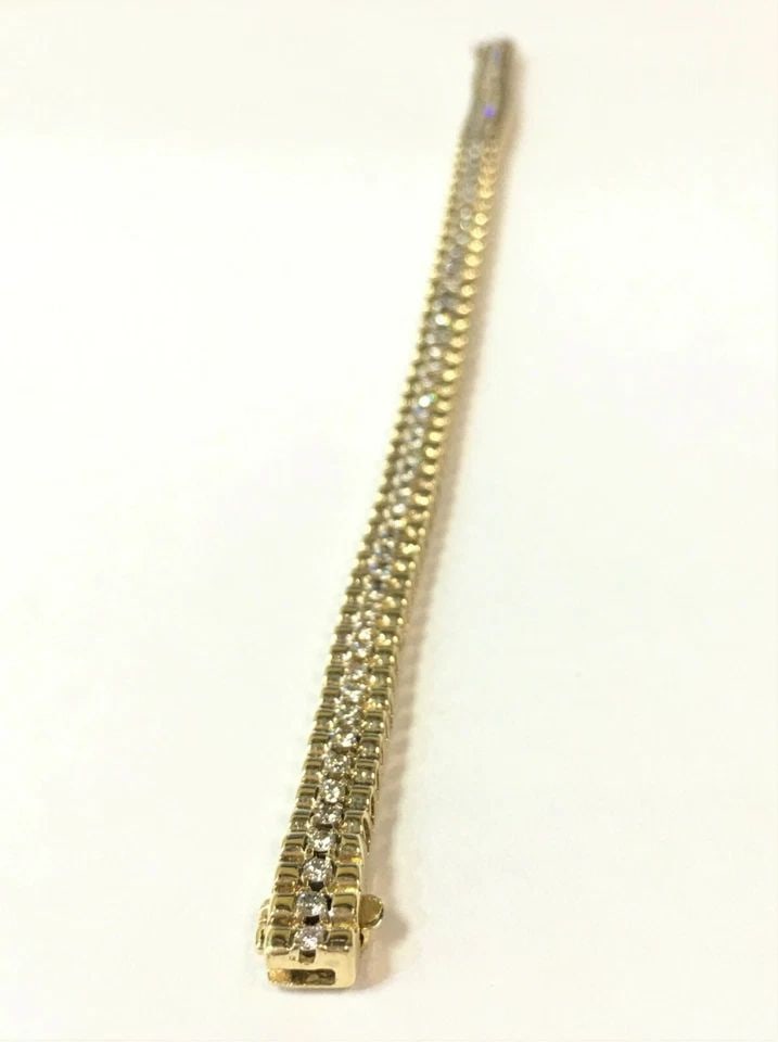 14K YELLOW GOLD BRACELET, 1.75CTW DIAMONDS (7 INCH ) 21.3 GRAM: 14K YELLOW GOLD BRACELET WITH DIAMONDS (7 INCH) 14k Yellow Gold Bracelet with Diamonds You are bidding on a 14k Yellow Gold Bracelet with Diamonds. The bracelet has some marks and scratches on it from