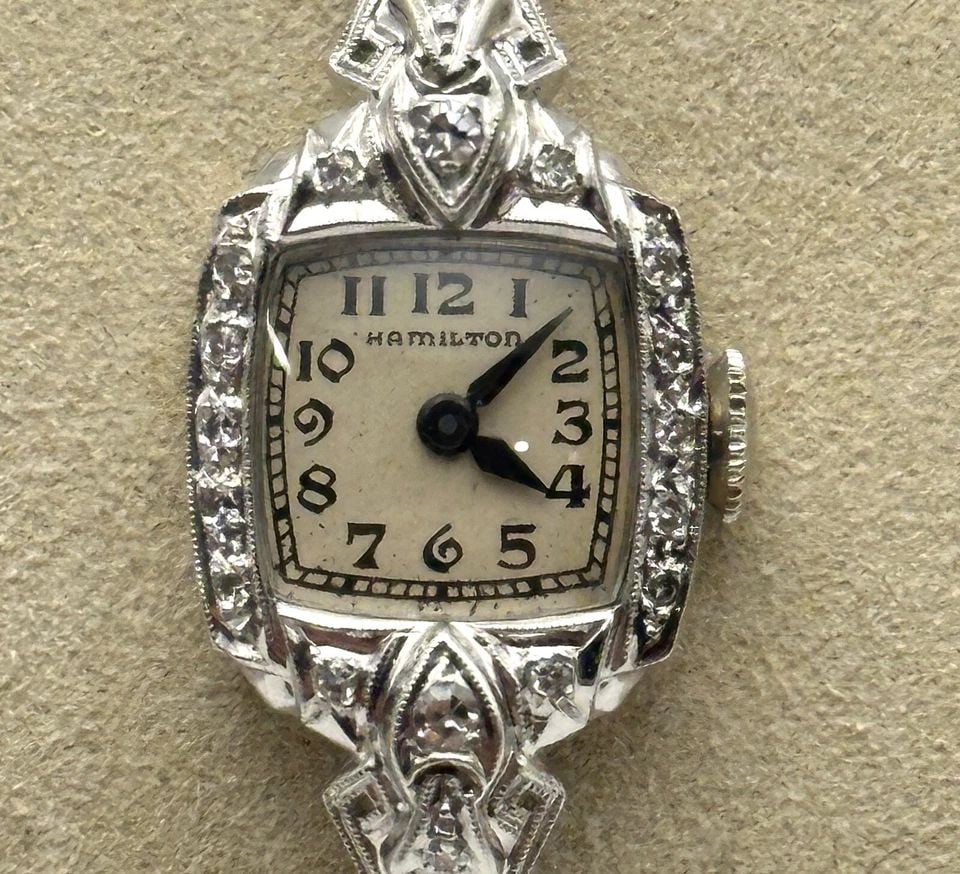 VINTAGE WOMAN'S HAMILTON WATCH 14K WHITE GOLD WITH 1.50CTS OF DIAMONDS: Vintage Woman's Hamilton Watch 14k White Gold with 1.50cts of Diamonds Condition: Used. Material: Solid 14kt white gold case and band. Weighs 11.4 grams without the movement inside and 14.5 grams with