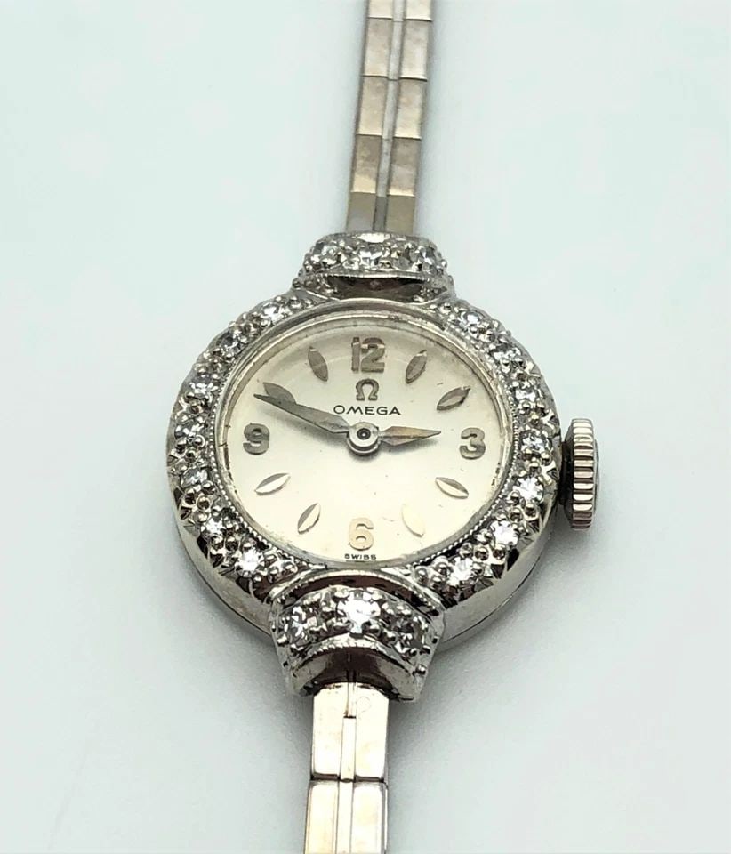 OMEGA WATCH 14K WHITE GOLD CASE AND BAND WITH DIAMOND BEZEL, OMEGA 481 17J MVMT: OMEGA WATCH 14K WHITE GOLD CASE AND BAND WITH DIAMOND BEZEL OMEGA Watch 14k White Gold case and band with Diamond bezel You are bidding on a OMEGA Watch 14k White Gold case and band with Diamond bezel