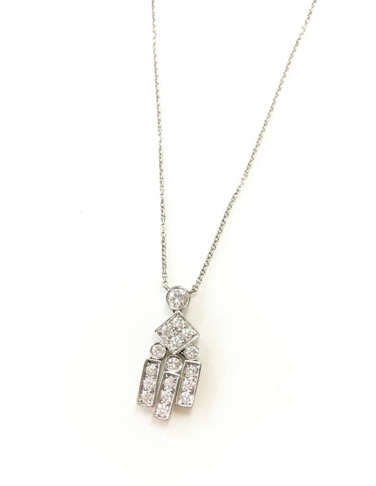 TIFFANY & CO. LEGACY PLATINUM NECKLACE, 0.69CTS DIAMOND CHARM ( 16 INCH ) 4.5G: TIFFANY & CO LEGACY DIAMOND PLATINUM NECKLACE (LENGTH 16IN) Tiffany & Co Legacy Diamond Platinum Necklace You are bidding on a Tiffany & Co Legacy Diamond Platinum Necklace. There are few minor scratc