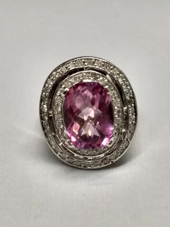 14K WHITE GOLD RING, 7.8CT PINK TOPAZ AND 0.97CTW DIAMONDS (SIZE: 6.5) 15 GRAM: 14K WHITE GOLD PINK TOPAZ AND DIAMOND RING 14k White Gold Pink Topaz and Diamond Ring You are bidding on a 14k white gold ring with topaz and rubies. The ring is new but has a fair amount of marks and