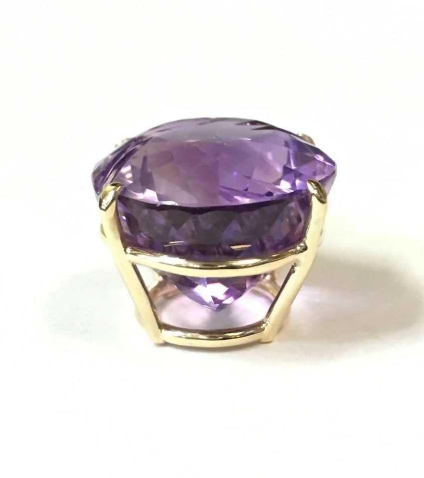14K YELLOW GOLD PENDANT WITH 40CT FANCY OVAL CUT AMETHYST, DIAMONDS, (13 GRAMS): 14K YELLOW GOLD PENDANT WITH CENTER 40CT FANCY OVAL CUT AMETHYST AND DIAMONDS 14k Yellow Gold Pendant with center 40ct Amethyst and Diamonds You are bidding on a 14k Yellow Gold Pendant with center 40