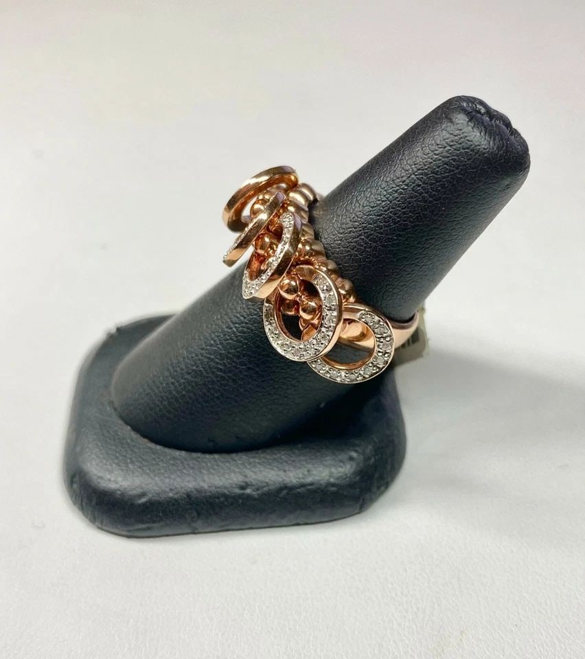 NEW 14K ROSE GOLD RING WITH DIAMONDS AND 5 ROSE GOLD HOOPS THAT MOVE FREELY: 14K ROSE GOLD RING WITH DIAMONDS AND 5 ROSE GOLD HOOPS THAT MOVE FREELY 14k Rose Gold Ring with Diamonds and 5 Rose Gold Hoops That Move Freely You are bidding on a new with defects 14k Rose Gold Ring