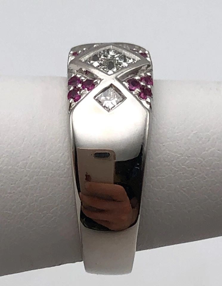 14K WHITE GOLD BAND WITH NATURAL RUBIES AND 0.42CTW DIAMONDS (SIZE: 6.25) 8 GRAM: 14K WHITE GOLD BAND WITH NATURAL RUBIES AND 0.42CTS OF DIAMONDS SIZE: 6.25 14k White Gold Band with natural Rubies and 0.42cts of Diamonds Condition: Used, Display model has been cleaned Material: 14k