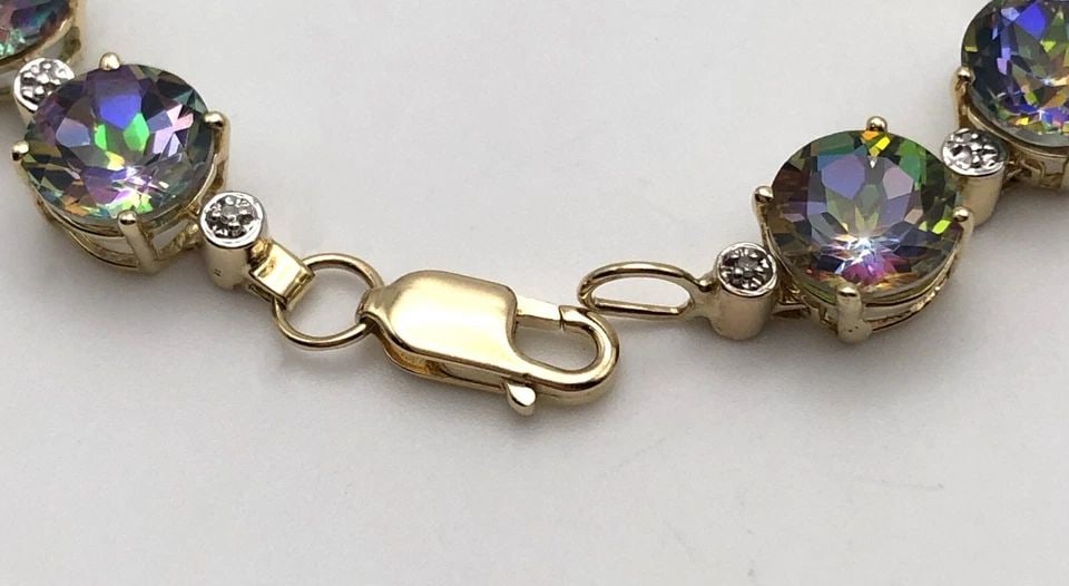 14K GOLD BRACELET WITH MYSTIC TOPAZ, 0.04CTS OF DIAMONDS (7.25 INCH) 16.5 GRAMS: 14K YELLOW GOLD BRACELET SET WITH MYSTIC TOPAZ AND 0.04 CTS OF DIAMONDS 7.25" 14k Yellow Gold Bracelet set with Mystic Topaz and 0.04 cts of Diamonds You are bidding on a 14k Yellow Gold Bracelet set 