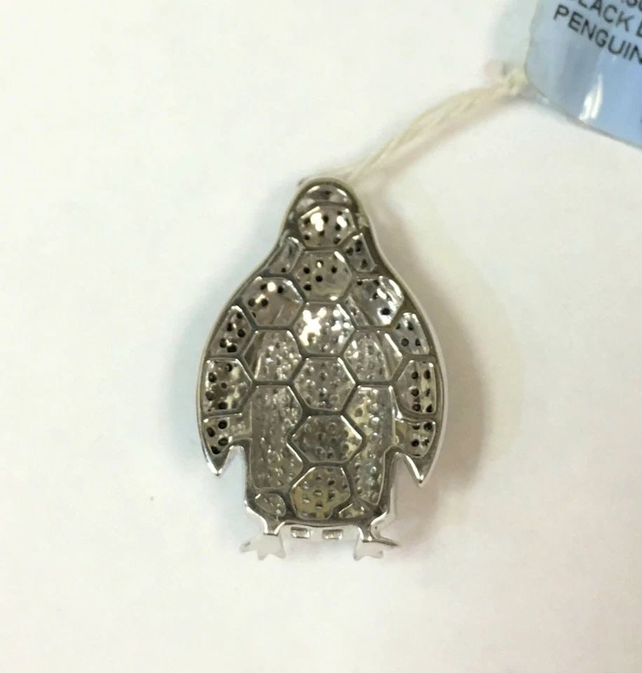 14K WHITE GOLD PENGUIN PENDANT WITH 1.5CTS BLACK AND WHITE DIAMONDS (5.5 GRAMS): 14K WHITE GOLD PENGUIN PENDANT WITH BLACK AND WHITE DIAMONDS 14k White Gold Penguin Pendant with Black and White Diamonds You are bidding on a 14k White Gold Penguin style Pendant with Black and White
