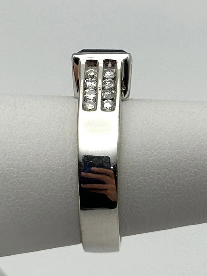 14K WHITE GOLD RING, 1.2CT LAB CREATED SAPPHIRE, 0.32CTS DIAMONDS SIZE: 7.25: 14k White Gold Ring, Lab Created Blue Sapphire and 0.32cts of natural Diamonds Condition: Used Material: 14k White Gold Ring Size: 7.25 Weight: 6.9 grams Top Width: 7mm Bottom Width: 4.2mm Stone Info: