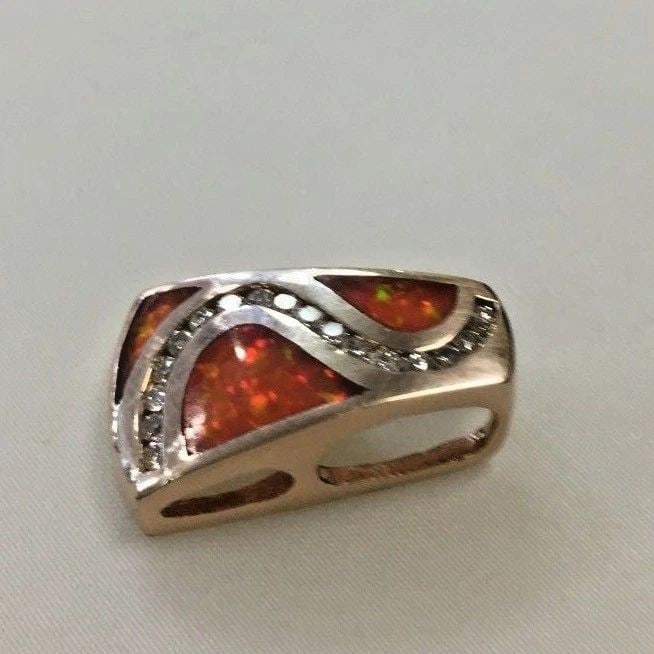 14K YELLOW GOLD FIRE OPAL AND 0.25CTS NATURAL DIAMOND PENDANT ( 6.1 GRAMS ) (1 of 2)