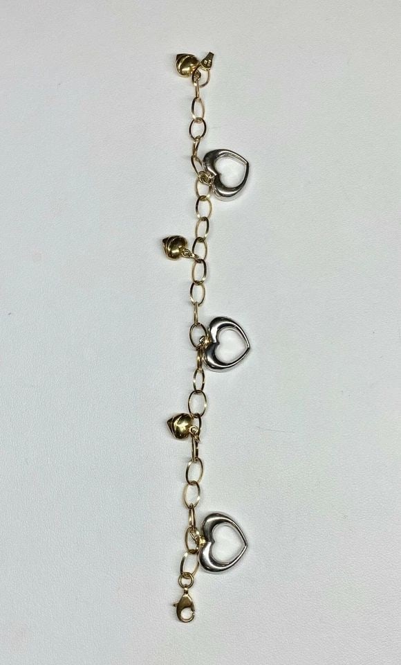 14K WHITE AND YELLOW GOLD HEART BRACELET (7 INCH) 7.7 GRAMS: WOMEN'S 14K WHITE AND YELLOW GOLD HEART BRACELET Women's 14k White and Yellow Gold Heart Bracelet You are bidding on a pre-owned Women's 14k White and Yellow Gold Heart Bracelet. The bracelet has mino