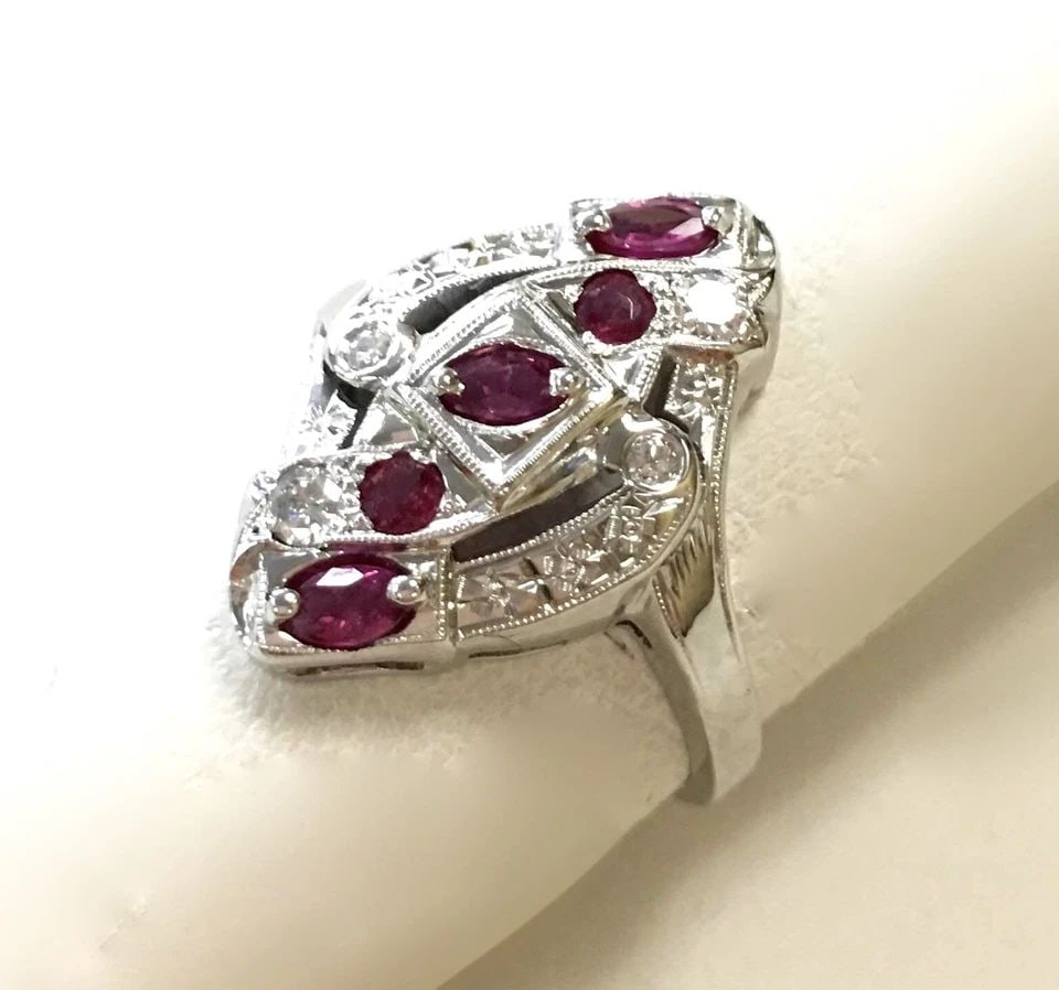 18K WHITE GOLD RING, 0.15CTS DIAMONDS, 0.25CTS RUBIES ( SIZE: 7.5 ) 4.8G: 18K WHITE GOLD RING WITH DIAMONDS AND NATURAL RUBY SIZE: 7.5 18k White Gold ring with Diamonds and natural Ruby You are bidding on a 18k White Gold ring with Diamonds and natural Ruby. There are few m