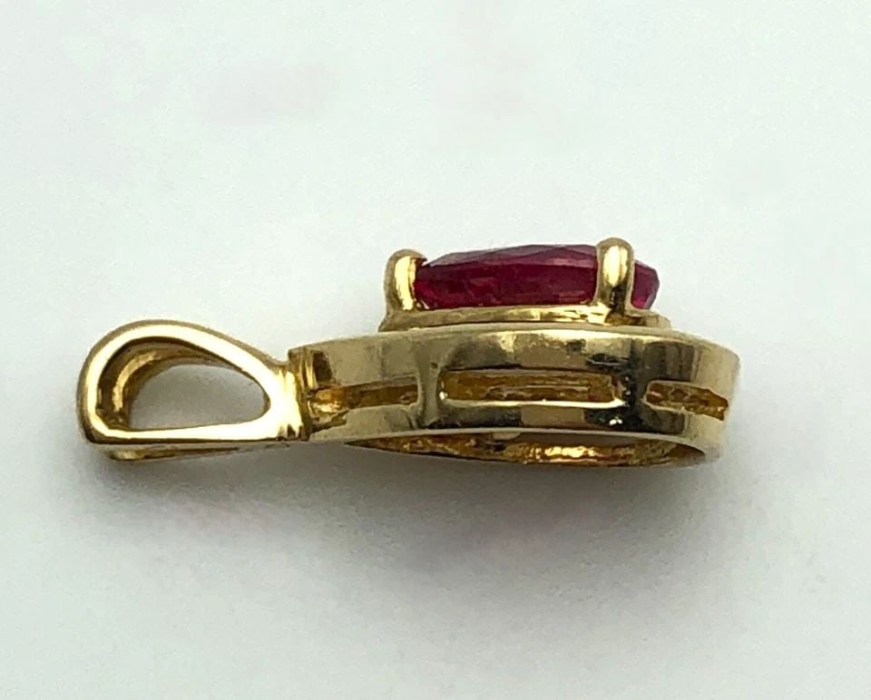 14K GOLD PEAR SHAPED PENDANT WITH 0.90CT RUBY & 0.26CTW DIAMONDS ( 1.3 GRAMS ) (1 of 2)