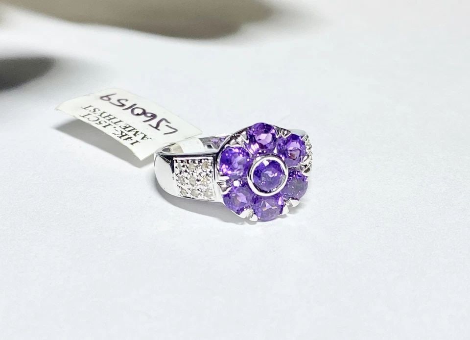 NEW 14K WHITE GOLD FLOWER RING WITH AMETHYST, 0.15CTW DIAMONDS (SIZE 7) 5 GRAM: WOMEN'S 14K WHITE GOLD FLOWER RING WITH AMETHYST AND 0.15CTS DIAMONDS (SIZE 7) Women's 14k White Gold Flower Ring with Amethyst and 0.15CTS Diamonds (Size 7) You are bidding on a new with tags Women's