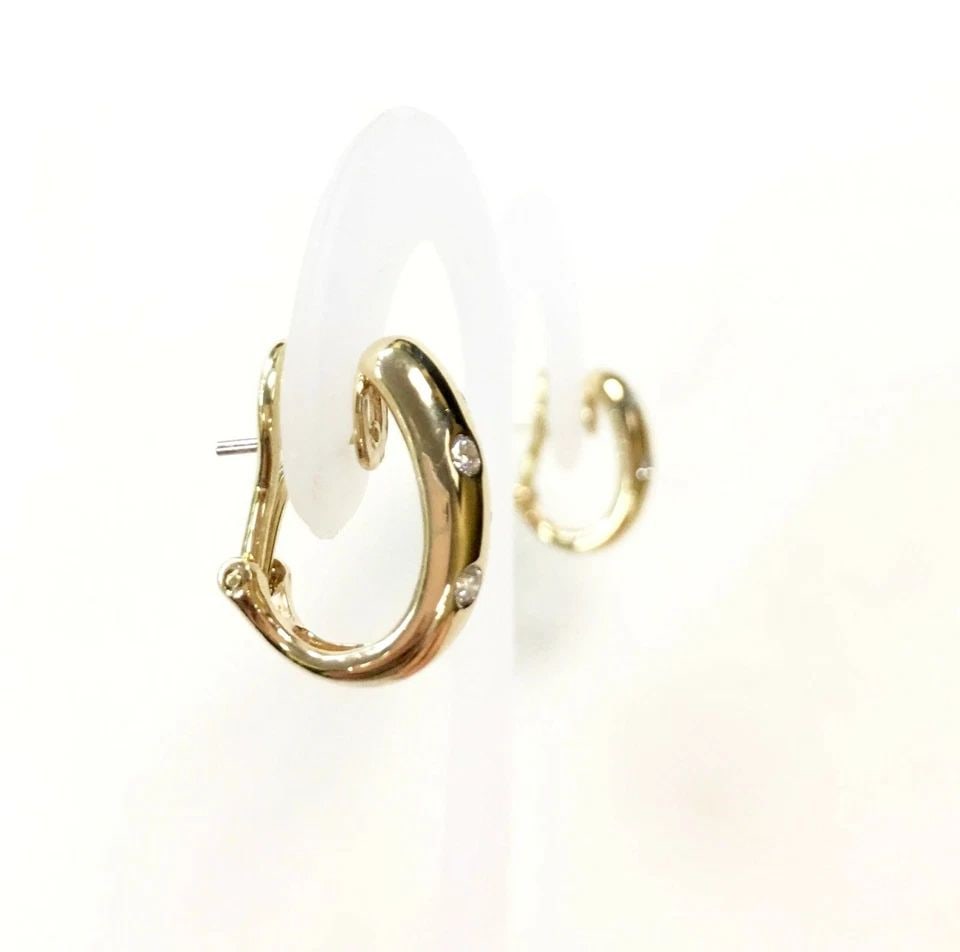 14K YELLOW GOLD EARRINGS WITH OMEGA BACKS AND 0.25CTW DIAMONDS 4.9GRAM: 14K YELLOW GOLD EARRINGS WITH OMEGA BACKS AND DIAMONDS 14k Yellow Gold Earrings with omega backs and Diamonds You are bidding on a 14k Yellow Gold Earrings with omega backs and Diamonds. There are few