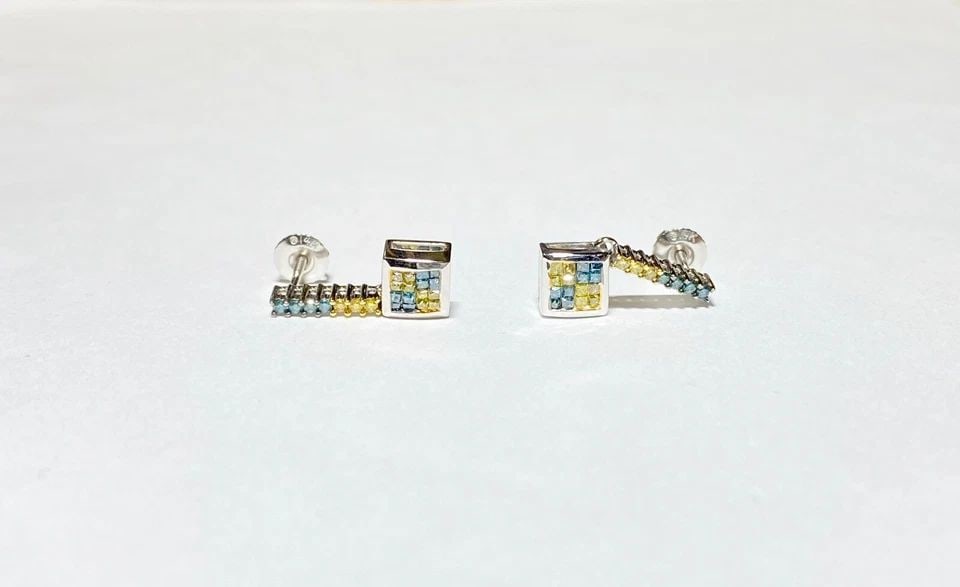 NEW 14K WHITE GOLD DANGLE EARRINGS, 0.60CTW YELLOW & BLUE DIAMONDS 3.1 GRAM: 14K WHITE GOLD EARRINGS WITH 0.60CTS YELLOW AND BLUE DIAMONDS 14k White Gold Earrings with 0.60CTS Yellow and Blue Diamonds You are bidding on a new with tags Women's 14k White Gold Earrings with 0.60