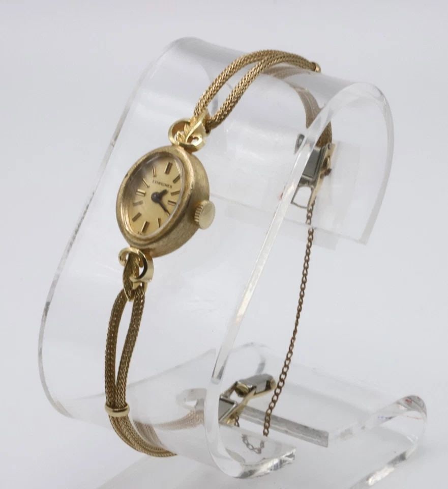 WOMAN'S VINTAGE LONGINES 14K YELLOW GOLD CASE WATCH 17 JEWELS (BAND NOT GOLD): WOMAN'S VINTAGE LONGINES 14K YELLOW GOLD WATCH 17 JEWELS Woman's Vintage Longines 14k Yellow Gold Watch 17 Jewels You are bidding on a Woman's Vintage Longines 14k Yellow Gold Watch 17 Jewels. The wat