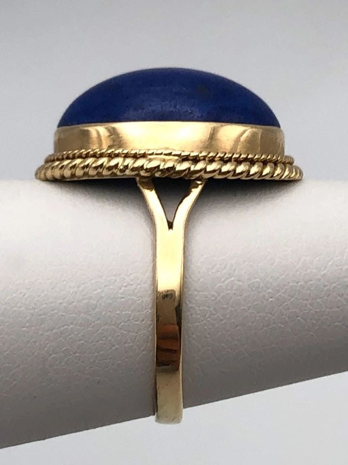 14K GOLD RING WITH OVAL SHAPED CABOCHON CUT BLUE LAPIS (SIZE: 5) 4.3 GRAMS: 14K GOLD RING WITH OVAL SHAPED CABOCHON CUT BLUE LAPIS SIZE: 5 14k Gold Ring with center Oval shaped Cabochon cut Blue Lapis Condition: Used Material:14k Yellow Gold Ring Size: 5 Weight: 4.3 grams Top