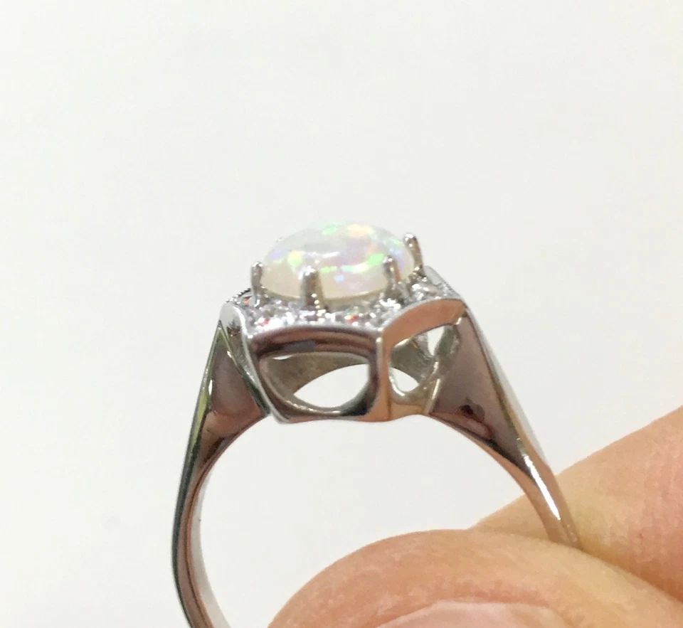 14K WHITE GOLD RING WITH NATURAL OPAL AND DIAMONDS (SIZE 6) 2.8 GRAMS: 14K WHITE GOLD RING WITH DIAMONDS AND OPAL SIZE: 6 14k White Gold Ring with Diamonds and Opal Size: 6 You are bidding on a 14k White Gold Ring with Diamonds and Opal. There are a few minor scratches o