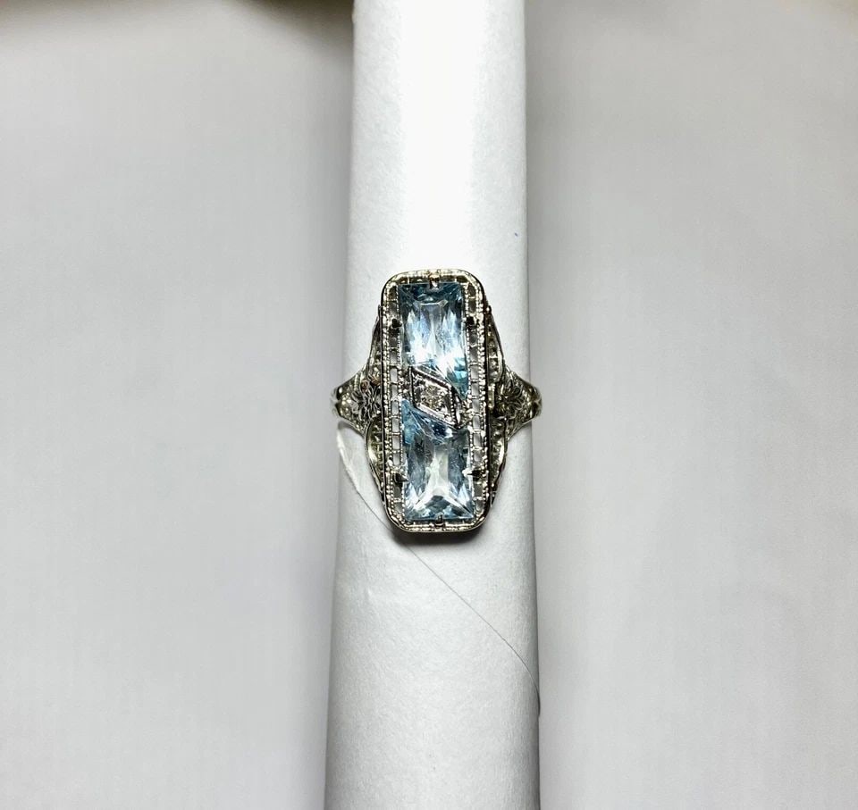 14K WHITE GOLD FILIGREE RING WITH BLUE TOPAZ AND DIAMOND (SIZE 6) 3.5 GRAMS: WOMEN'S WHITE GOLD FILIGREE RING WITH BLUE TOPAZ AND 0.02CT DIAMONDS (SIZE 6) Women's White Gold Filigree Ring with Blue Topaz and 0.02CT Diamonds (Size 6) You are bidding on a pre-owned Women's White