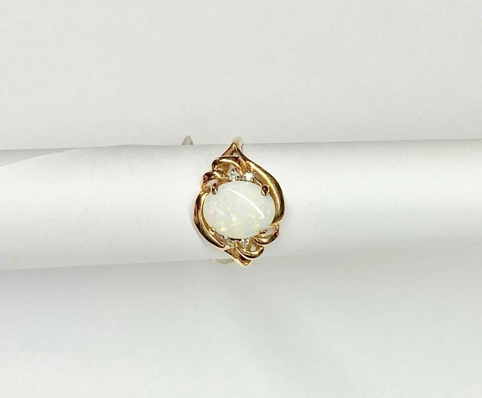 NEW 14K GOLD RING WITH NATURAL OPAL AND 0.05CTW DIAMONDS (SIZE 6) 2.6 GRAM: WOMEN'S 14K YELLOW GOLD RING WITH 10X8MM NATURAL OPAL (SIZE 6) Women's 14k Yellow Gold Ring with 10x8mm Natural Opal (Size 6) You are bidding on a new with tags Women's 14k Yellow Gold Ring with Natur