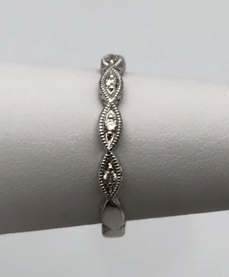 GABRIEL & CO. 14K WHITE GOLD BAND WITH 0.08CTS DIAMONDS (SIZE 6.75) 2.3 GRAMS: GABRIEL & CO. 14K WHITE GOLD RING / BAND WITH 0.08CTS DIAMONDS SIZE: 6.75 Gabriel & Co. 14k White Gold Ring / Band with 0.08cts of Diamonds Condition: Display Model, no box or papers Material:14k Whit