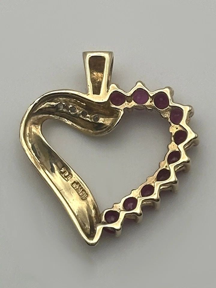 10K GOLD HEART PENDANT WITH 1.6CTW RUBIES AND 0.04CTW DIAMONDS 1.9 GRAMS (1 of 2)