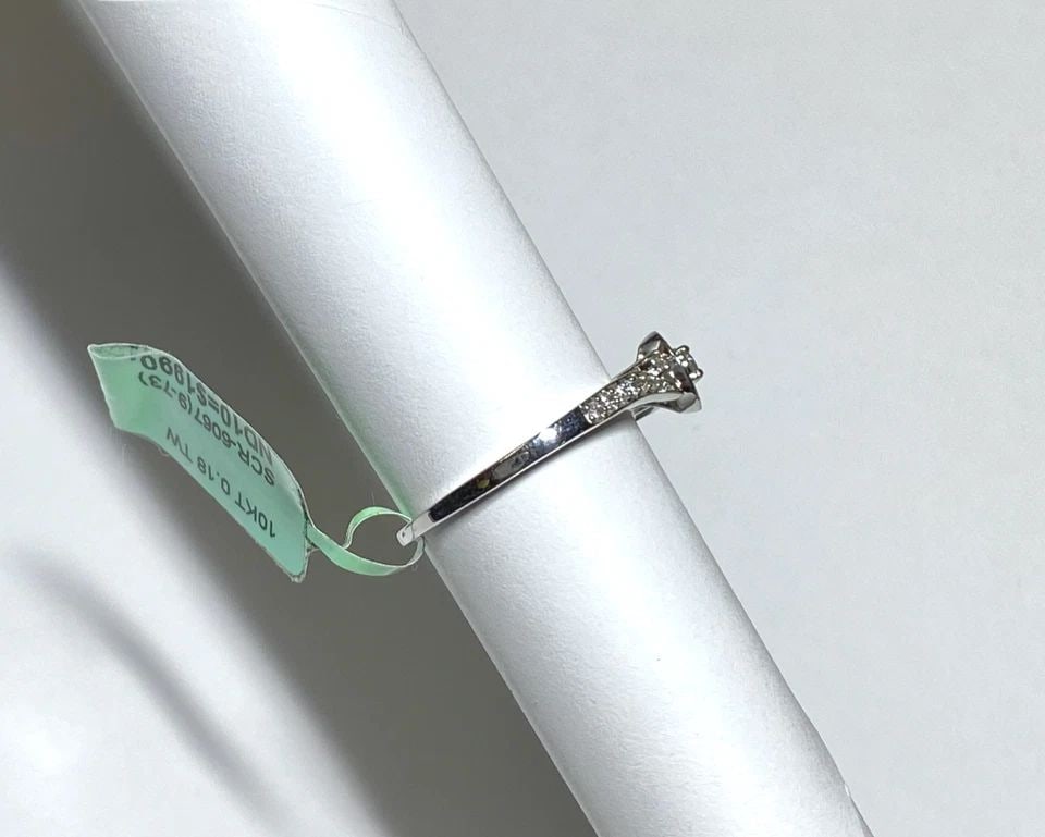 NEW WOMEN'S 10K WHITE GOLD ROUND RING WITH 0.18CTW DIAMONDS (SIZE 7.5) 2.5 GRAM: WOMEN'S 10K WHITE GOLD RING WITH 0.18CT DIAMONDS (SIZE 7.5) Women's 10k White Gold Ring with 0.18CT Diamonds (Size 7.5) You are bidding on a new with tags Women's 10k White Gold Ring with 0.18CT Diamo