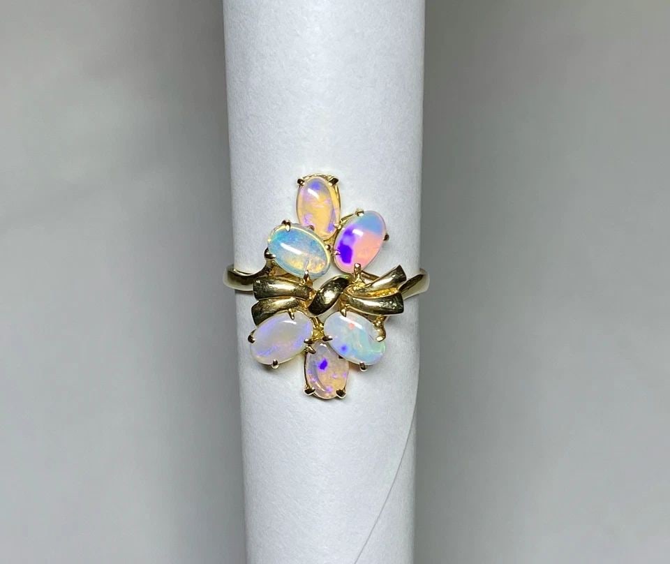 NEW 14K GOLD RING BOWTIE STYLE, 1.57CTS NATURAL OPALS (SIZE 7) 2.6 GRAMS: WOMEN'S 14K YELLOW GOLD RING WITH 1.57CT NATURAL OPALS (SIZE 7) Women's 14k Yellow Gold Ring with 1.57CT Natural Opals (Size 7) You are bidding on a new with tags Women's 14k Yellow Gold Ring with 1.5