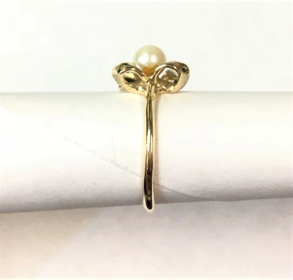 14K GOLD RIBBON STYLE RING WITH 5MM CULTURED PEARL (SIZE 6) 2.5 GRAMS: 14K GOLD RIBBON STYLE RING SET WITH CENTER PEARL (SIZE: 6) 14k Gold Ribbon style Ring set with center Pearl You are bidding on a 14k Gold Ribbon style Ring set with center Pearl. The ring has been ful