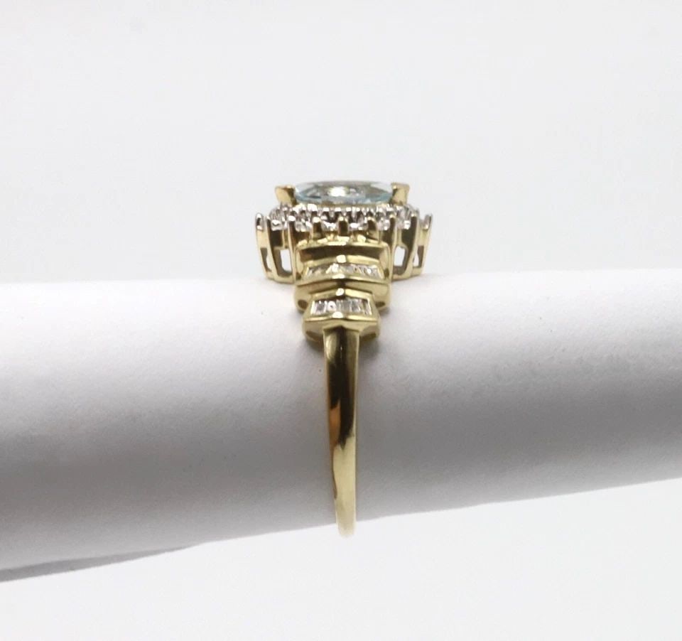 10K YELLOW GOLD RING WITH MARQUISE AQUAMARINE AND DIAMONDS (SIZE 7.25) 2.9 GRAM: 10K YELLOW GOLD RING WITH CENTER MARQUISE AQUAMARINE AND DIAMONDS SIZE: 7.25 10k Yellow Gold Ring with center Marquise Aquamarine and Diamonds You are bidding on a 10k Yellow Gold Ring with center Mar
