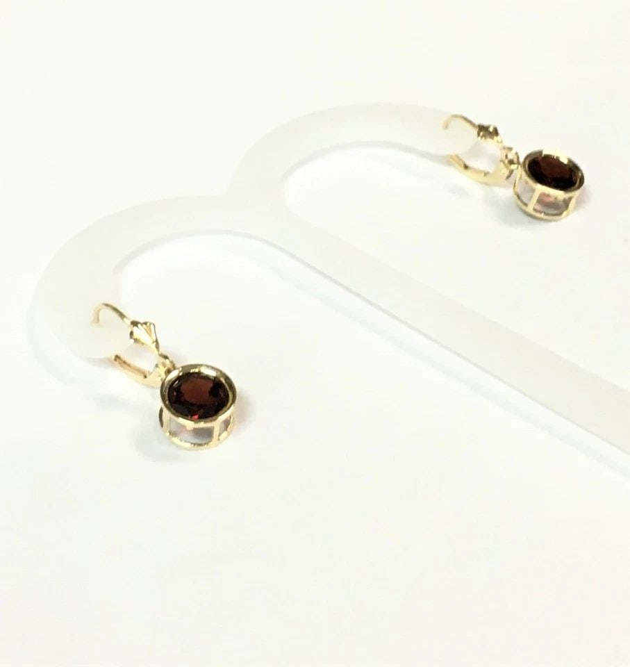 14K TWO TONED GOLD, DANGLE EARRINGS SET WITH GARNETS 2.5 GRAMS: 14K YELLOW GOLD DANGLE EARRINGS SET WITH GARNETS 14k Yellow Gold dangle Earrings Set with Garnets You are bidding on a pre-owned 14k Yellow Gold dangle Earrings Set with Garnets. The piece has marks a