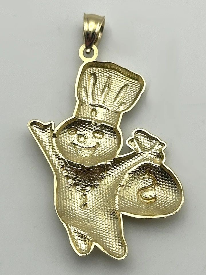 NEW 10K GOLD DOUGH BOY WITH MONEY BAG PENDANT 2.9 GRAMS: 10k Gold Dough Boy with Money Bag Pendant Condition: Brand New, Display Model Material: 10k Yellow Gold Pendant Size: 25mm wide, 34mm tall plus a 6.8mm tall bail Total Weight: 2.9 grams Bail Info: Fit
