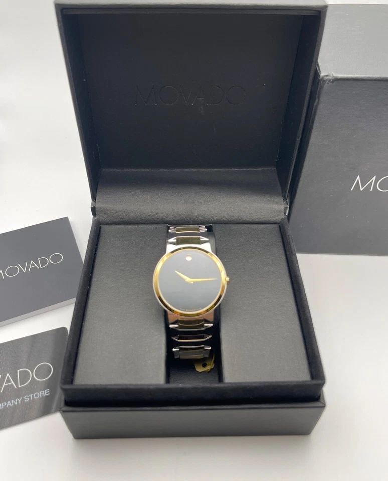 MOVADO 0606952 TWO TONED STAINLESS STEEL WATCH WITH ORIGINAL BOX AND PAPERS: MOVADO 0606952 TWO TONED STAINLESS STEEL WATCH WITH ORIGINAL BOX AND PAPERS Movado 0606952 Two Toned Stainless Steel Watch with Original Box and Papers You are bidding on a Movado 0606952 Two Toned St
