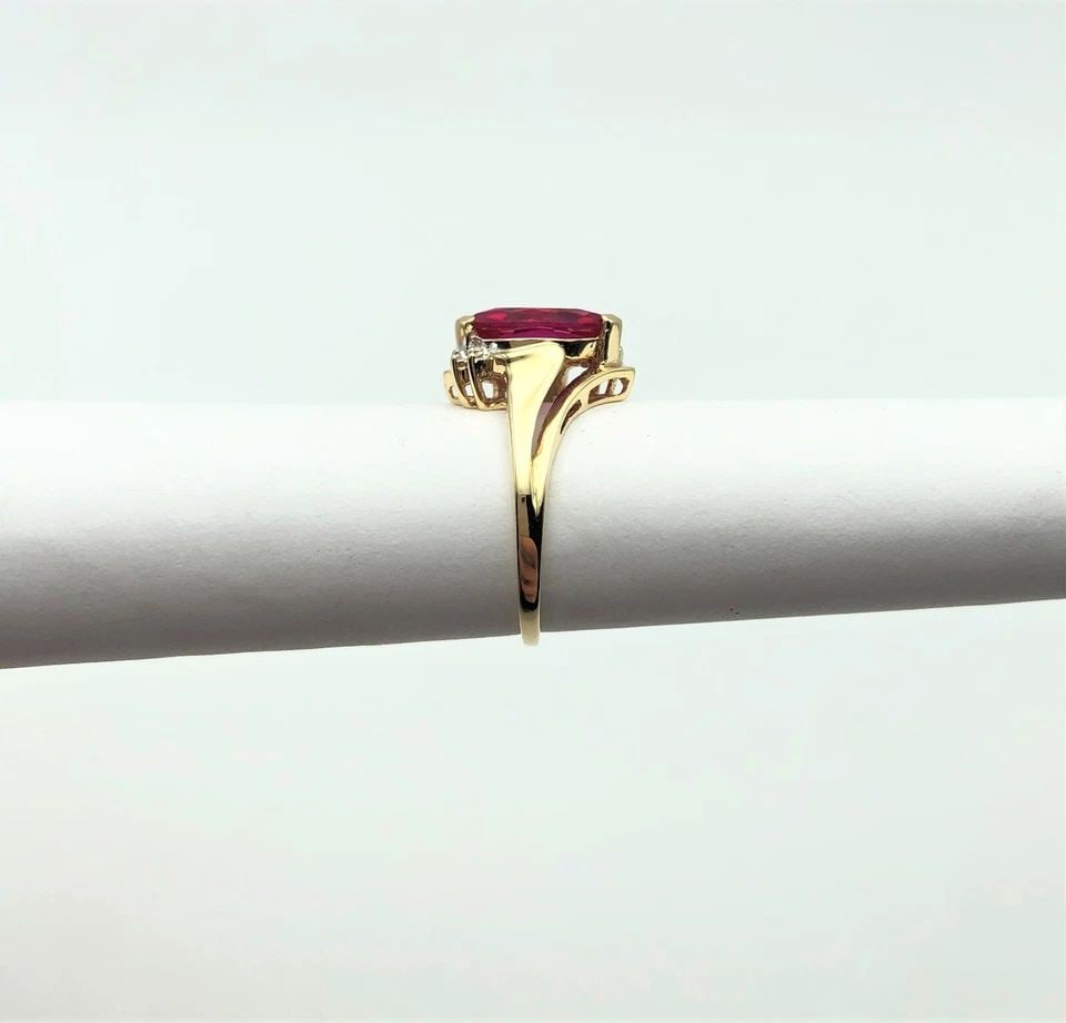 10K GOLD RING, MARQUISE LAB-CREATED RUBY, 0.01CTW DIAMONDS (SIZE 5.5) 2.7 GRAM: 10K GOLD RING SET WITH CENTER SYNTHETIC RUBY AND SIDE DIAMONDS (SIZE: 5.5) 10k Gold Ring set with center Synthetic Ruby and side Diamonds You are bidding on a 10k Gold Ring set with center Synthetic R