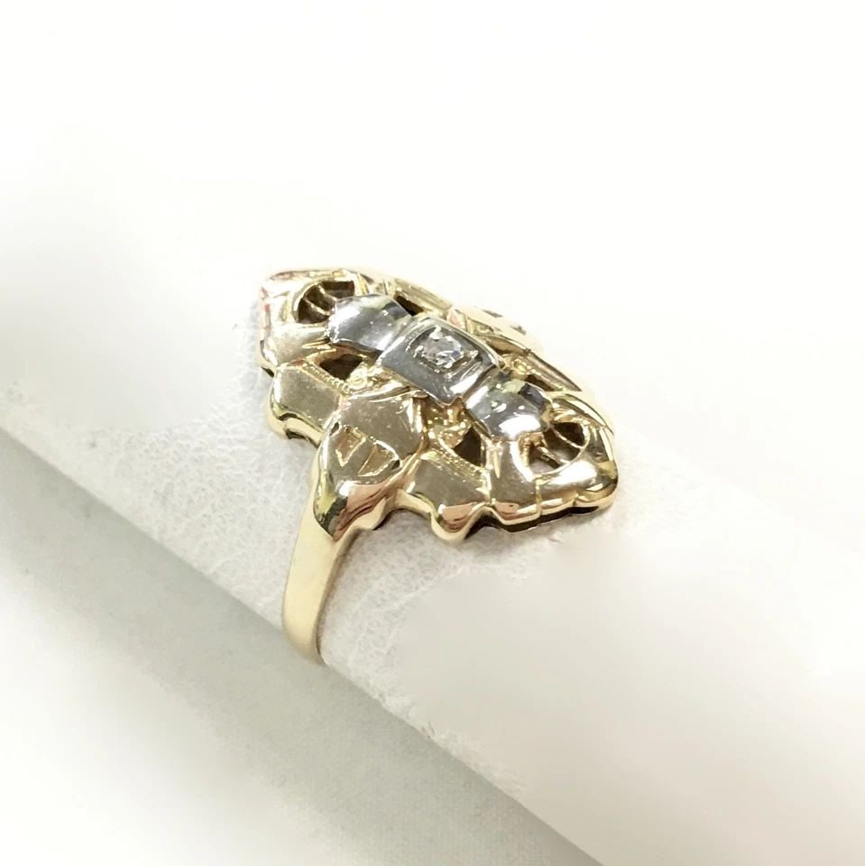 14K GOLD OVAL SHAPED ARTISAN TWO TONE RING WITH DIAMOND (SIZE 5) 2 GRAMS: 14K GOLD RING WITH DIAMOND SIZE: 5 14k Gold Ring with Diamond You are bidding on a 14k Gold Ring with Diamond. There are few minor scratches on the ring from being moved around in inventory. See pictu