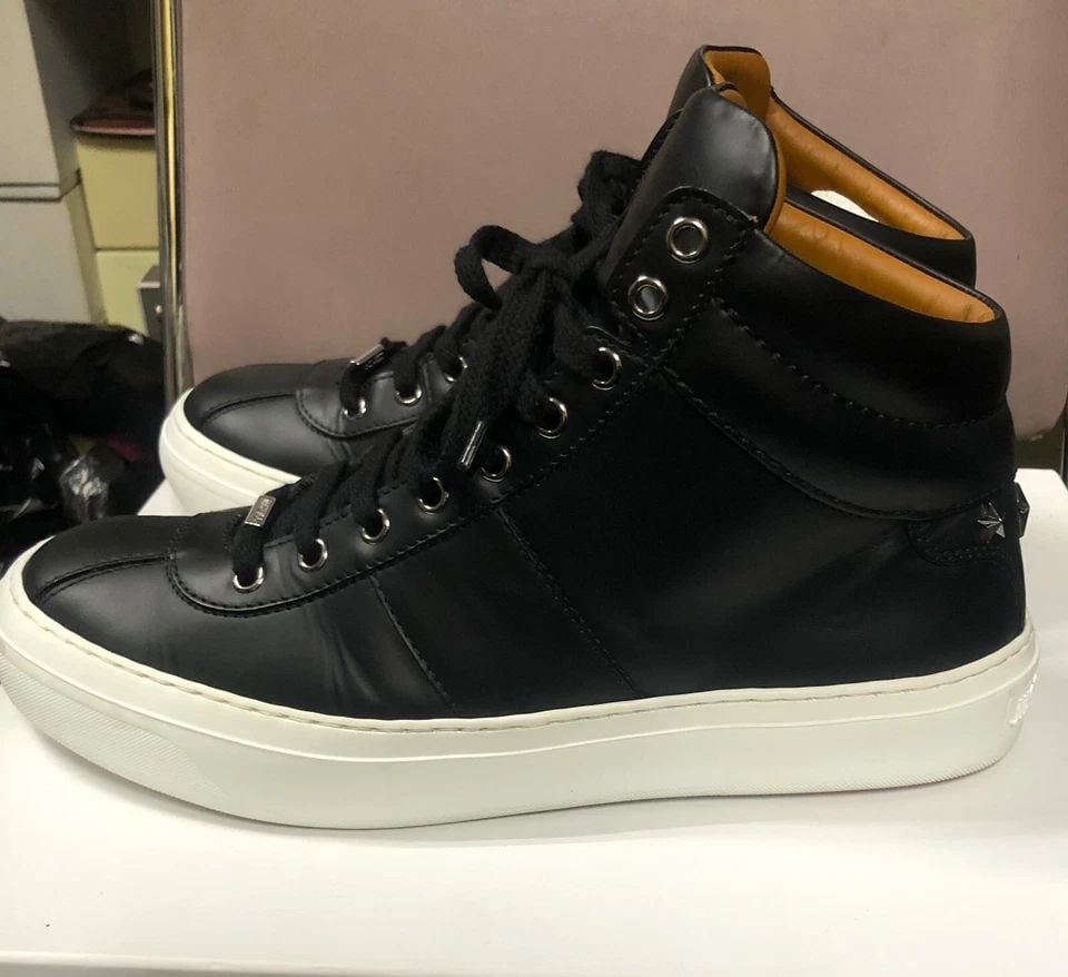 JIMMY CHOO BLACK HIGH TOP SNEAKERS, STUDDED BACKS SIZE: 41: JIMMY CHOO BLACK HIGH TOP SNEAKERS, STUDDED BACKS SIZE: 41 JIMMY CHOO Black High top Sneakers, Studded Backs Condition: Display pair, light wear Material: Leather, and Rubber Mid to lower Sole Shoe Si